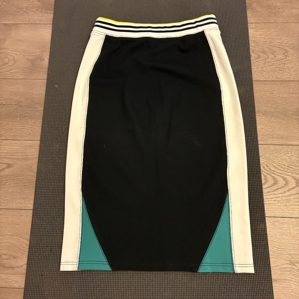 ANTHROPOLOGIE PENCIL SKIRT - body is black, side panels are white and green.
